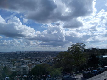 View of town against cloudy sky