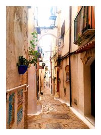 Narrow alley along buildings