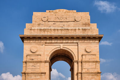 Low angle view of historical building against cloudy sky