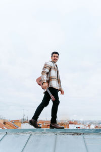 Full length of man standing against sky