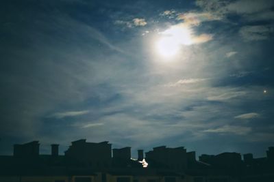 Low angle view of silhouette buildings against sky during sunset
