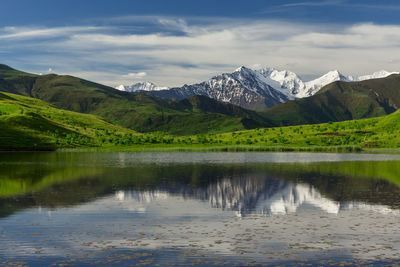 Lake in the mountains of chechnya. the mountains and the lake in the mountains are visible.