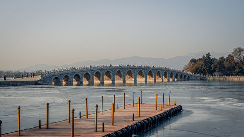 View of bridge over river against sky