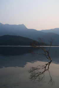 Scenic view of lake against sky during sunset