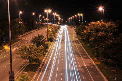 High angle view of light trails on road