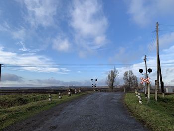Road passing through landscape against sky