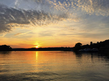 Scenic view of lake against sky during sunset