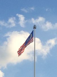Low angle view of flag against sky