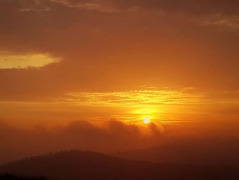 Scenic view of dramatic sky during sunset