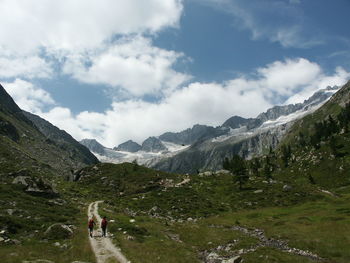 Scenic view of mountains against cloudy sky