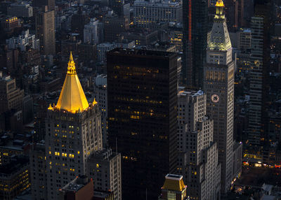 Aerial view of city lit up at night