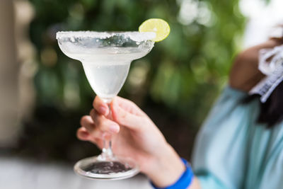 Close-up of woman holding drink