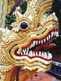 Low angle view of statue against temple building