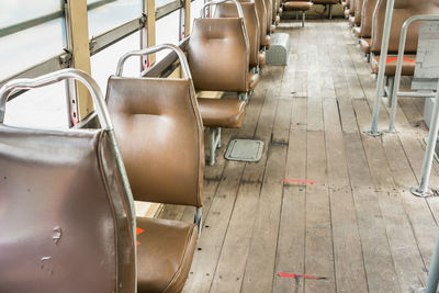 Empty leather seat inside the vintage auto bus of bangkok metropolis, thailand transportation