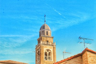 Low angle view of building against blue sky