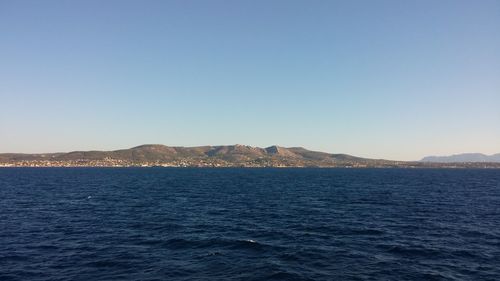 Scenic view of calm sea against clear sky