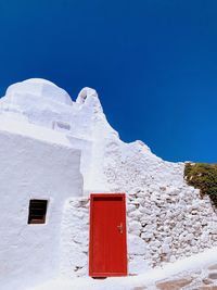 White greek building against clear blue sky