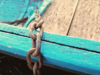 Close-up of rope tied up on metal