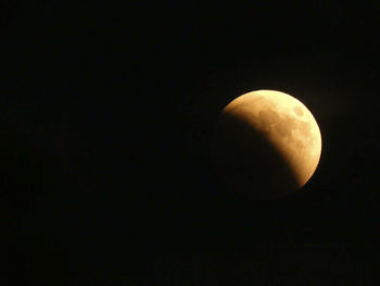 Low angle view of moon against sky at night