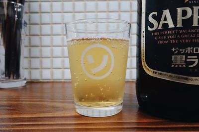 Close-up of beer glass on table