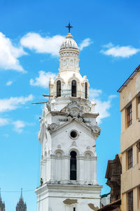 Low angle view of church against blue sky