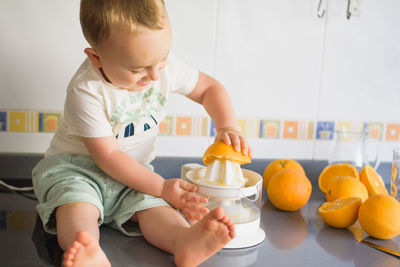 Close-up of boy eating food at home