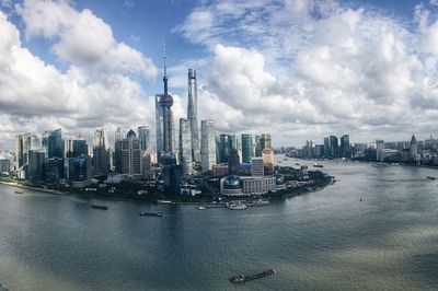 Panoramic view of buildings in city against sky