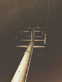 Low angle view of illuminated bridge against sky at night