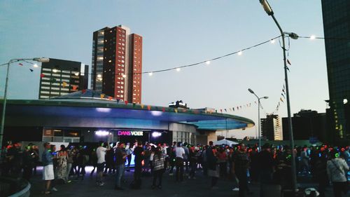 Group of people in city at night