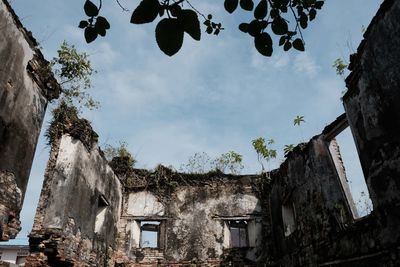 Low angle view of old building against sky