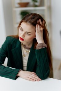 Young woman using laptop at home