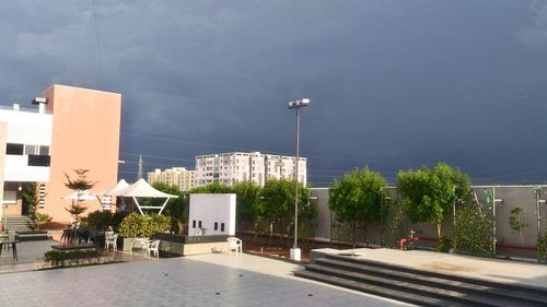 Street amidst buildings against sky