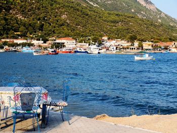 Scenic view of sea against buildings