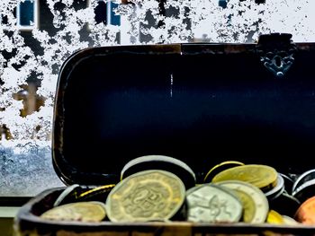 High angle view of coins in container