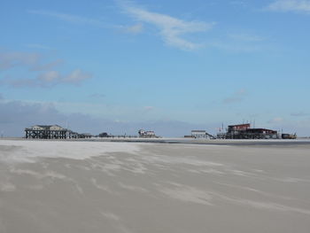 Calm sea with buildings in background