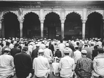 Group of people in front of historic building