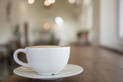 Close-up of coffee cup on table