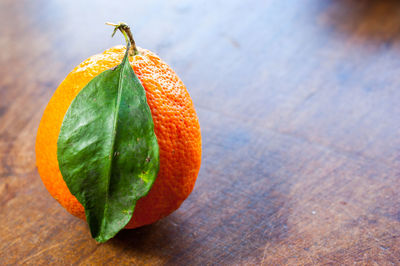 Close-up of orange fruit on table