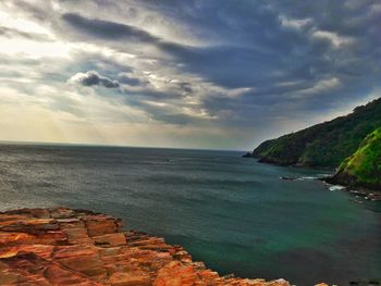 Scenic view of sea against cloudy sky