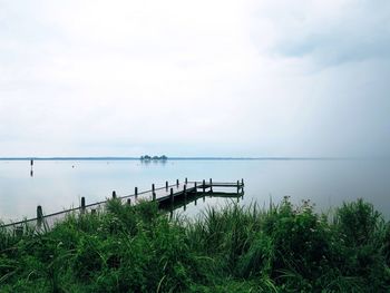 Scenic view of sea against cloudy sky