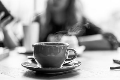 Close-up of coffee cup on table