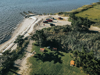 High angle view of trees by sea