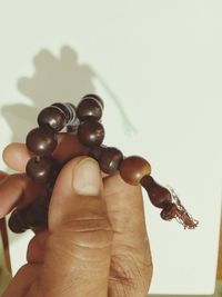 Close-up of human hand against white background