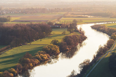 High angle view of canal amidst field