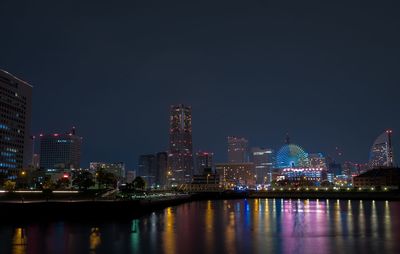 Illuminated cityscape at night