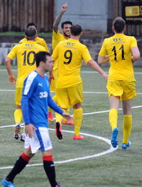 Rear view of two people playing soccer