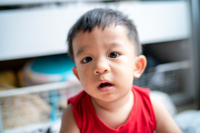 Portrait of cute baby boy at home