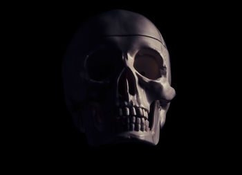 Close up of electric lamp against black background