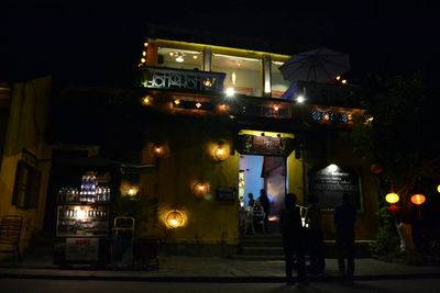 Illuminated buildings in city at night