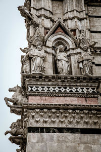 Low angle view of statue against sky